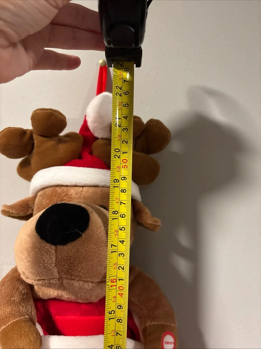 Holiday singing stocking with puppy dog sings jingle bells